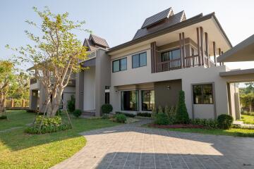 modern two-story house with a garden