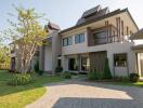 modern two-story house with a garden