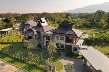 Exterior view of a modern house with a spacious yard