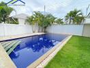 Outdoor swimming pool with surrounding greenery