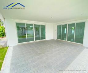 Covered outdoor patio with sliding glass doors