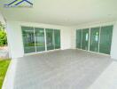 Covered outdoor patio with sliding glass doors