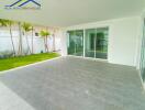 Covered patio with tiled flooring and garden view