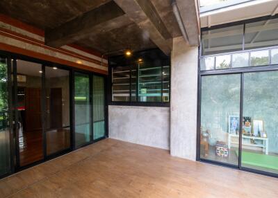 Modern living room with large windows and wooden floor