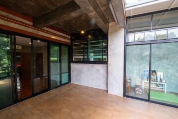 Modern living room with large windows and wooden floor