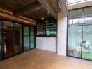 Modern living room with large windows and wooden floor