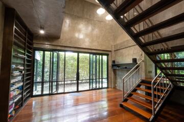 Modern main living space with large windows and staircase