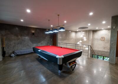 Spacious game room with a pool table