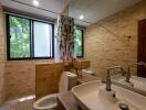 Modern bathroom with double sinks and large windows