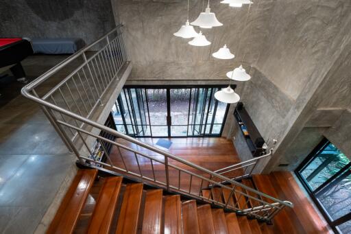 Modern interior with staircase and large windows