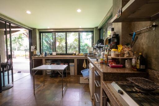 Spacious kitchen with modern appliances and large windows