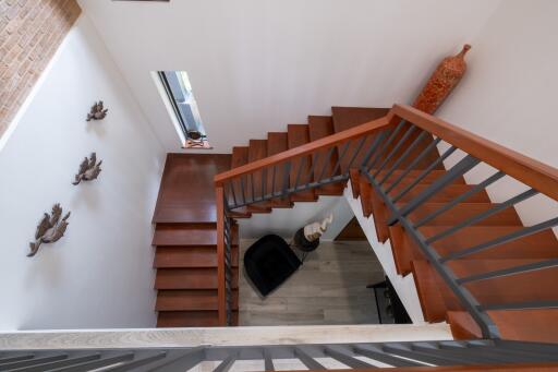 Modern interior staircase with wooden steps and decorative elements