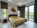 Modern bedroom with large windows and scenic view