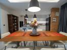 Modern dining area with wooden table and contemporary lighting