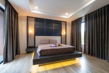 Modern bedroom with floating bed and ambient lighting