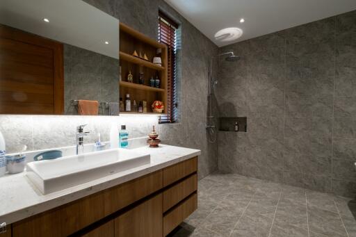 Modern bathroom with vanity, sink, and walk-in shower