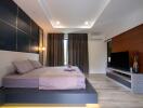 Modern bedroom with platform bed and entertainment unit