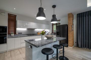 Modern kitchen with island and bar stools