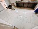 workers installing marble tiles on floor