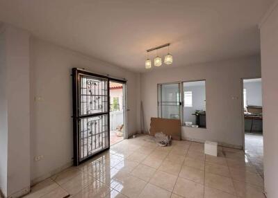 Spacious living room with tiled flooring