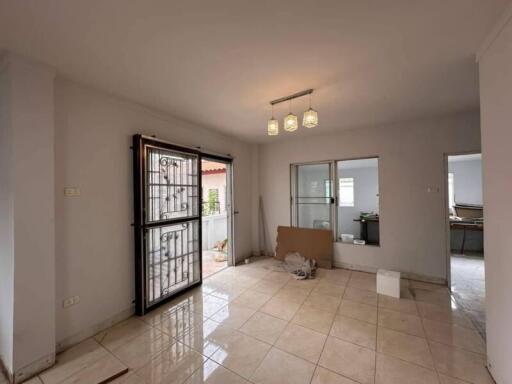 Spacious living room with tiled flooring