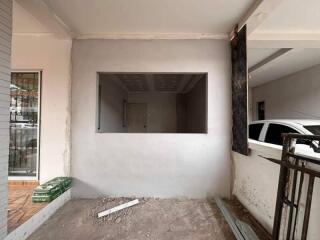 Garage or unfinished space with window and car