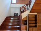 Wooden staircase with built-in shelving