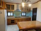 Welcoming kitchen space with wooden cabinetry and modern appliances