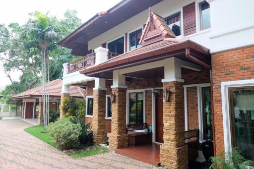 Exterior view of a house with a landscaped yard