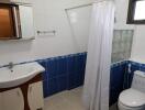 Modern bathroom with blue and white tiles