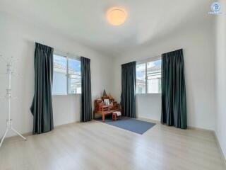 Minimalist bedroom with large windows and natural lighting