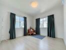 Minimalist bedroom with large windows and natural lighting