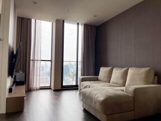 Modern living room with city view and comfortable sofa