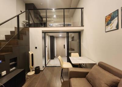 Modern duplex living area with loft