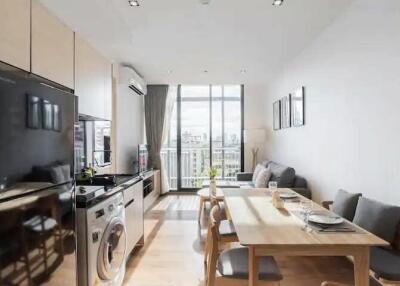 Modern open-plan kitchen and living area with natural light