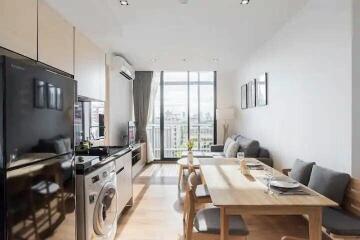 Modern open-plan kitchen and living area with natural light