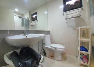 Modern bathroom with sink, toilet, and shower