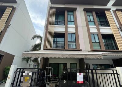 Three-story townhouse with gated driveway