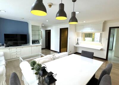 Modern living room with dining area and TV