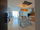 Modern dining area with white chairs and a large window, view extends to partial kitchen