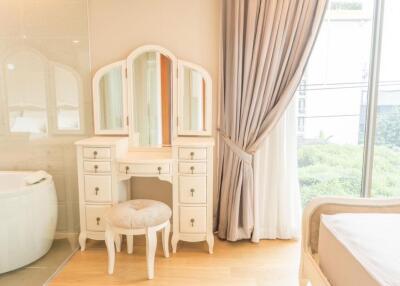 Elegant bedroom with dressing table and window view