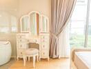 Elegant bedroom with dressing table and window view