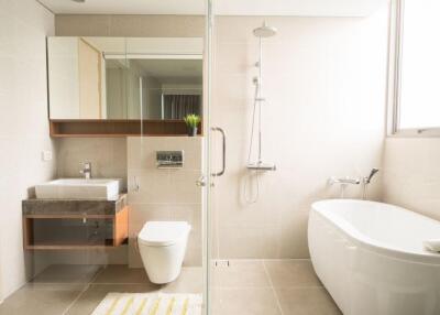 Modern bathroom with shower, bathtub, and sink