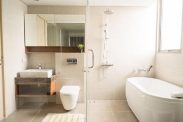 Modern bathroom with shower, bathtub, and sink