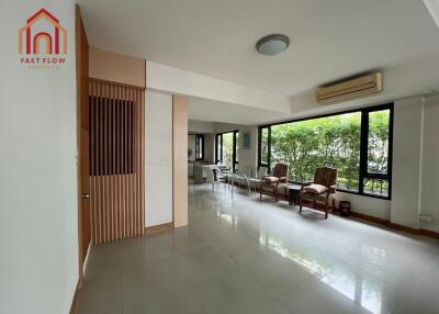 Spacious living area with large windows and natural light