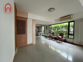 Spacious living area with large windows and natural light