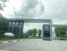 Entrance to the Setthasiri residential estate with gate and security checkpoint