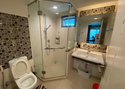 Modern bathroom with glass shower and large sink