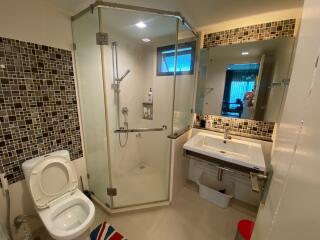 Modern bathroom with glass shower and large sink