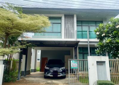 Modern residential building with car parked in driveway